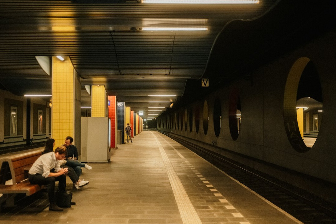 Commuters waiting on a metro station platform