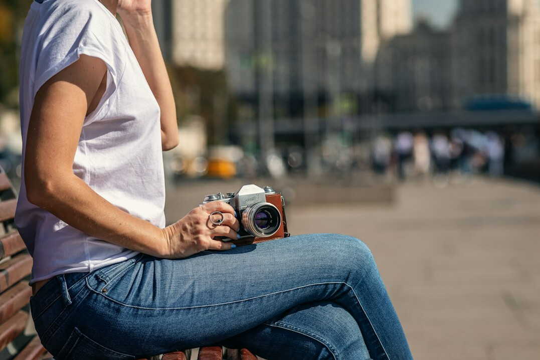 Chilean woman photographer reviewing photos on camera screen